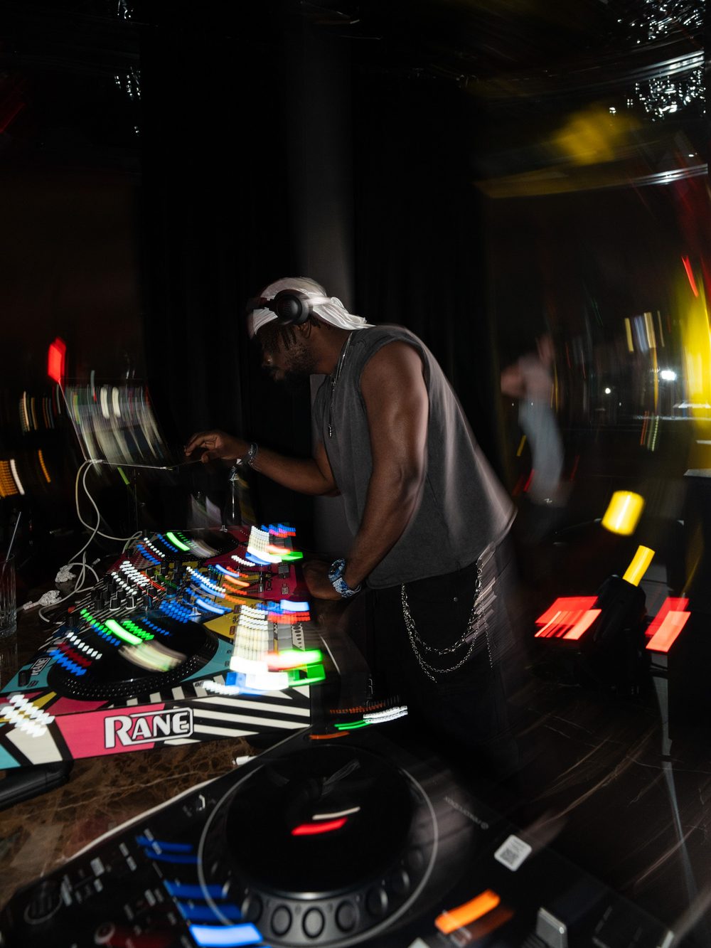 Long exposure shot of DJ Papi scratching on Rane controllers